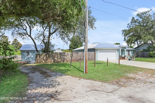 view of front of house featuring a garage and a front yard