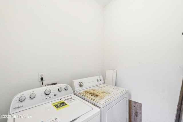 washroom featuring laundry area and washer and clothes dryer