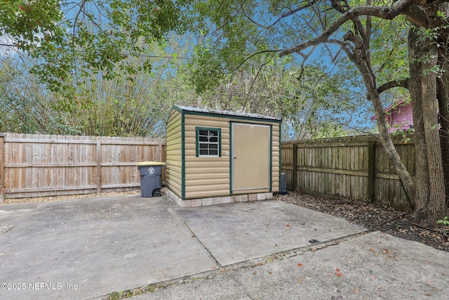 view of shed featuring a fenced backyard