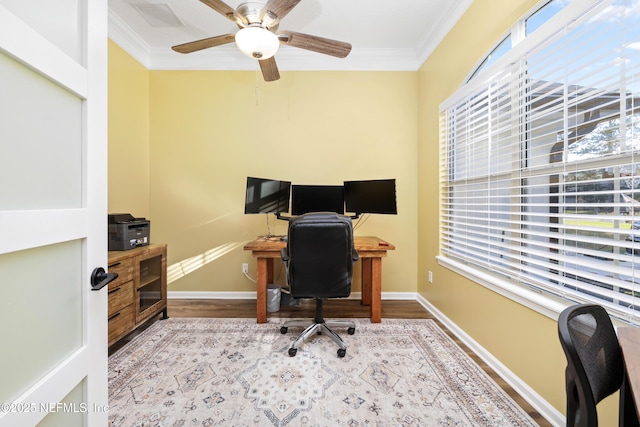 office area with light wood-type flooring, ceiling fan, and ornamental molding