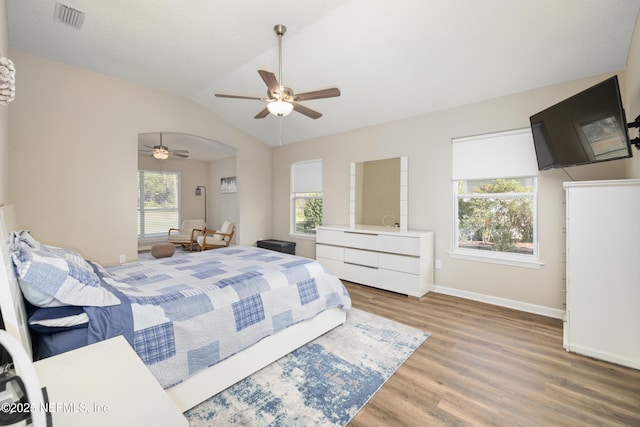 bedroom with hardwood / wood-style floors, ceiling fan, and lofted ceiling