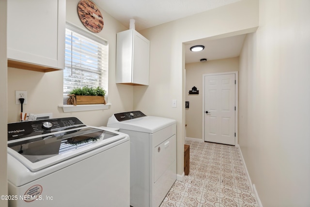 washroom with light tile patterned floors, cabinets, and independent washer and dryer