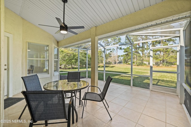 sunroom featuring ceiling fan and lofted ceiling