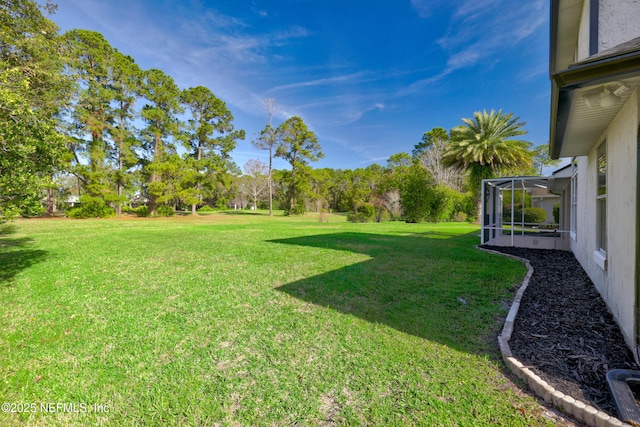 view of yard with a lanai