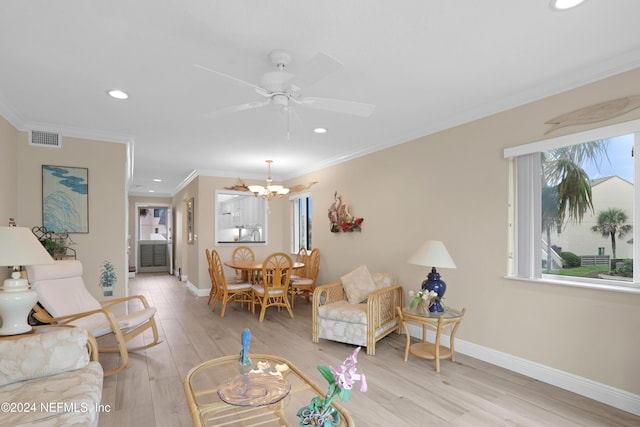 living room featuring light hardwood / wood-style flooring, ceiling fan with notable chandelier, and ornamental molding