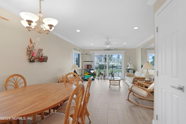 dining room featuring ceiling fan with notable chandelier, light hardwood / wood-style floors, and ornamental molding