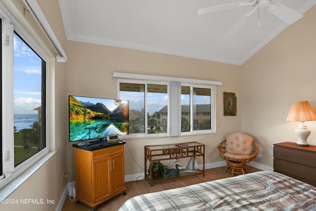 bedroom featuring light hardwood / wood-style flooring, ceiling fan, and ornamental molding