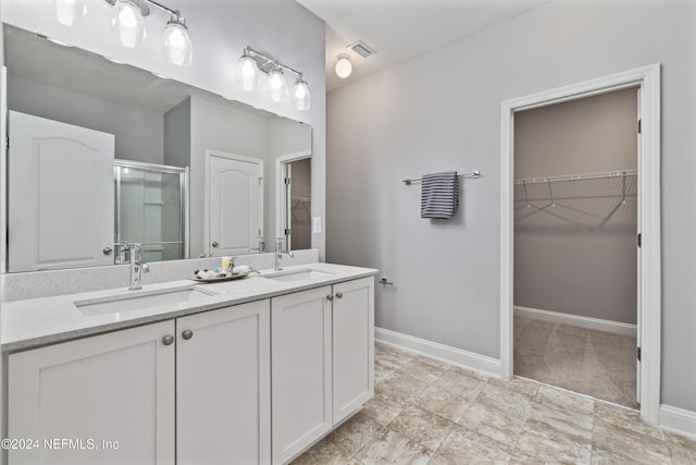 bathroom with vanity and an enclosed shower