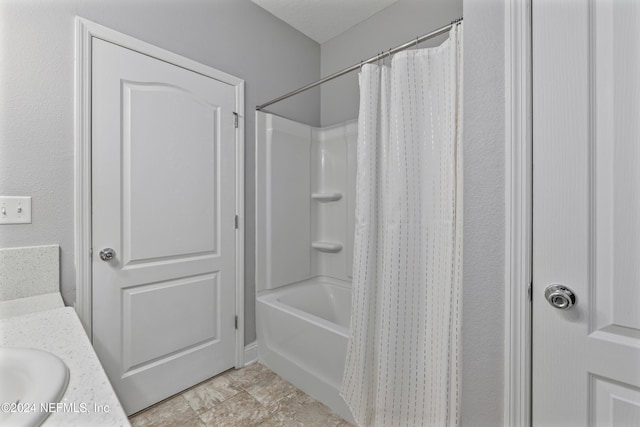 bathroom with vanity and shower / tub combo