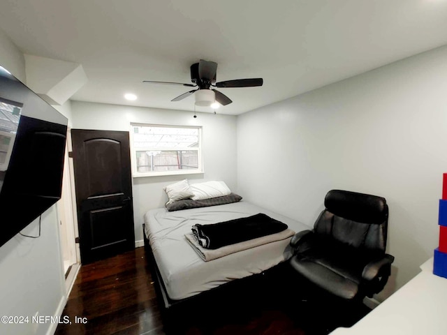 bedroom featuring dark wood-style floors and ceiling fan