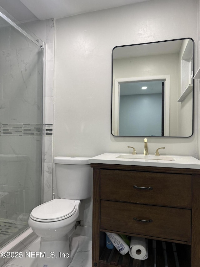 full bathroom featuring marble finish floor, toilet, vanity, and a marble finish shower