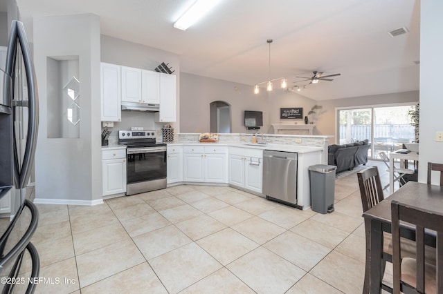 kitchen featuring kitchen peninsula, stainless steel appliances, ceiling fan, pendant lighting, and white cabinetry