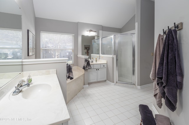 bathroom with tile patterned flooring, vanity, a shower with door, and vaulted ceiling