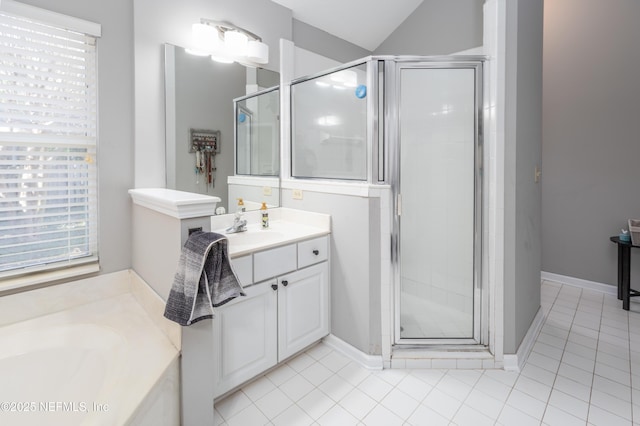 bathroom featuring tile patterned flooring, vanity, a shower with door, and lofted ceiling