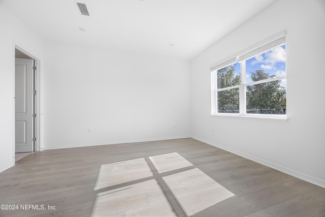 unfurnished room featuring light wood-type flooring