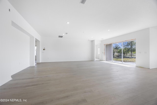 unfurnished living room featuring light hardwood / wood-style floors