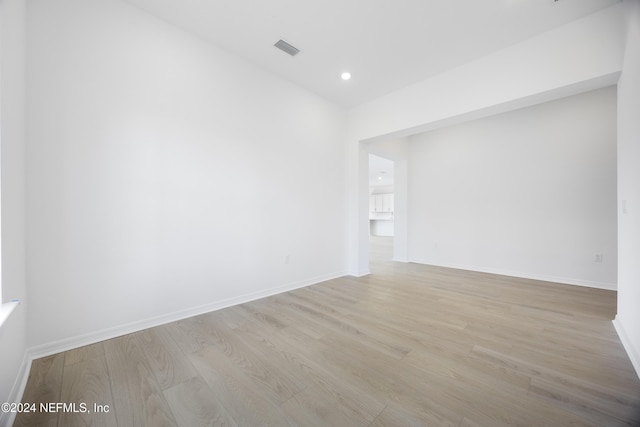 spare room featuring light wood-type flooring