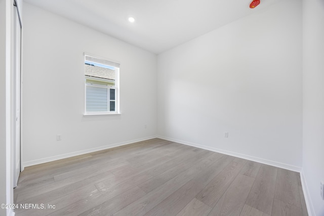 unfurnished room featuring light hardwood / wood-style flooring