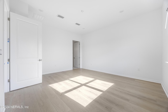 spare room with light wood-type flooring