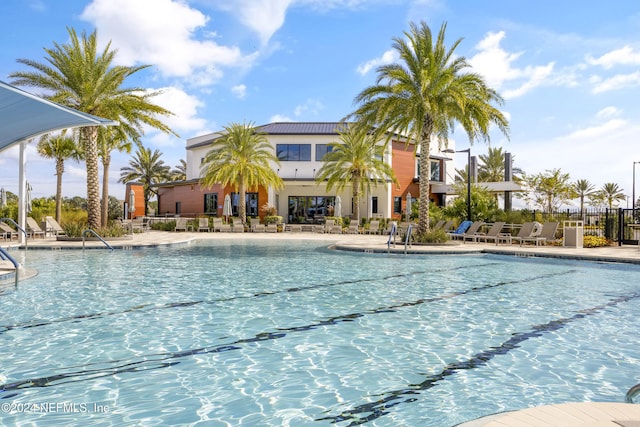 view of swimming pool with a patio