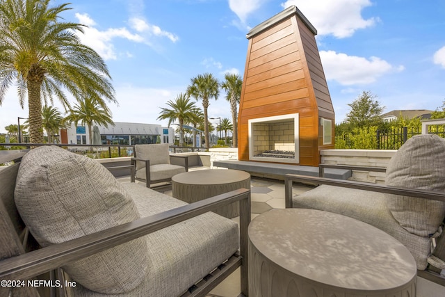 view of patio featuring an outdoor fireplace