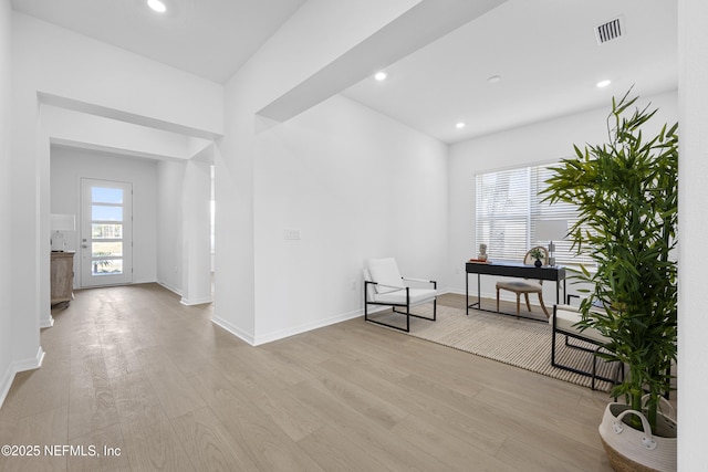 living area with light hardwood / wood-style floors