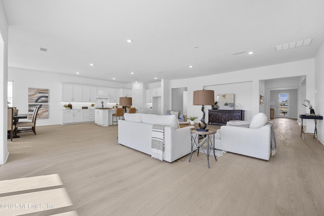 living room with light hardwood / wood-style floors