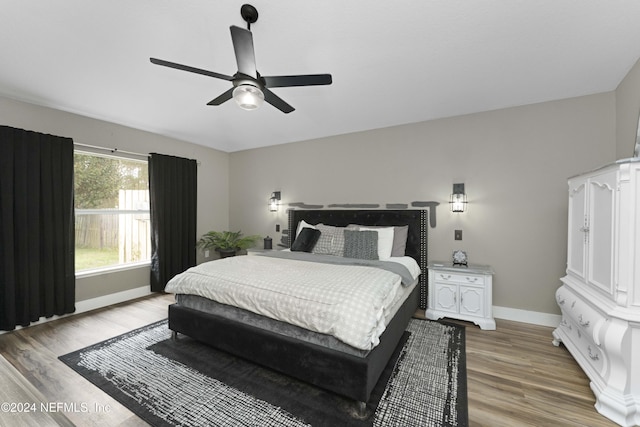 bedroom featuring wood-type flooring and ceiling fan