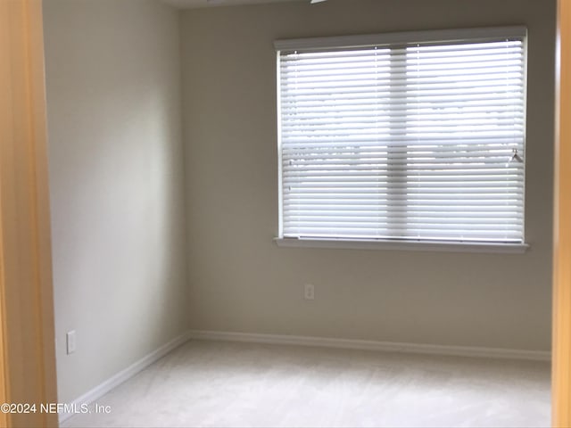 empty room featuring carpet floors