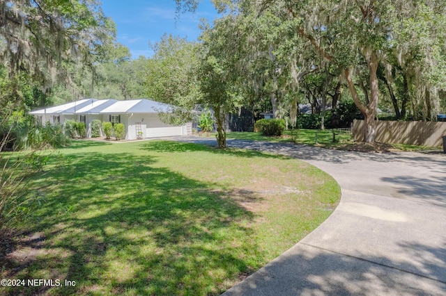 view of yard featuring a garage