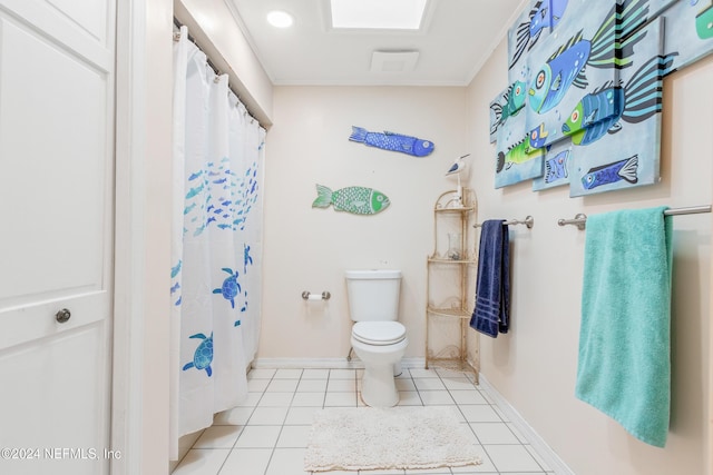 bathroom featuring tile patterned flooring, a shower with curtain, and toilet