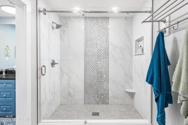 bathroom with vanity and an enclosed shower