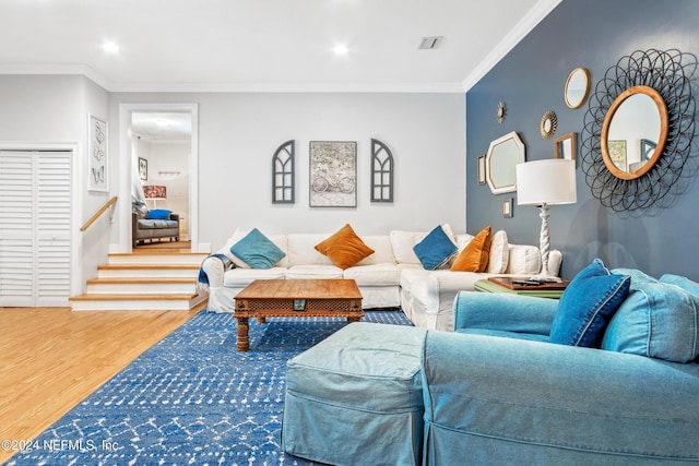 living room featuring hardwood / wood-style floors and ornamental molding