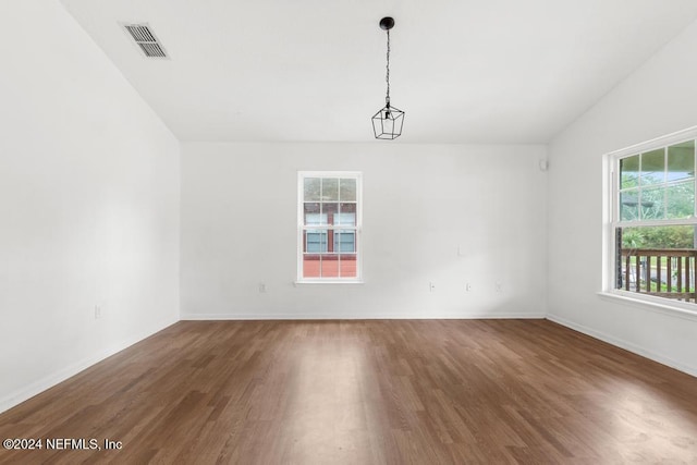 unfurnished room featuring dark hardwood / wood-style floors