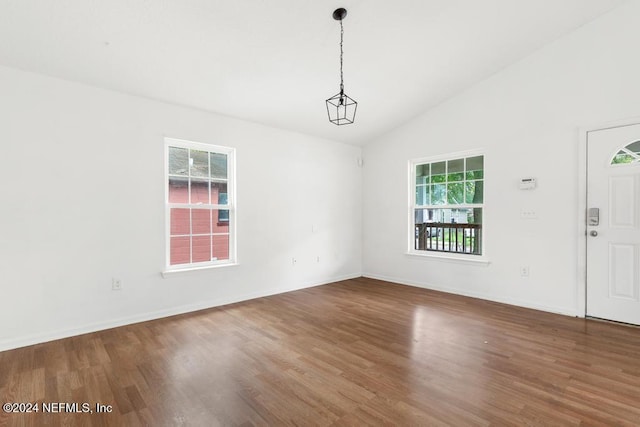 unfurnished room with high vaulted ceiling, wood-type flooring, and a wealth of natural light