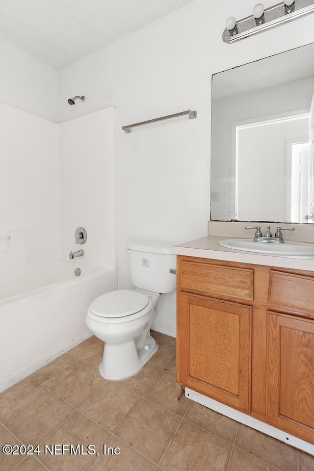 full bathroom with tile patterned floors, vanity, shower / bathing tub combination, and toilet