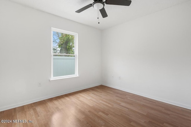 unfurnished room with ceiling fan and light hardwood / wood-style flooring