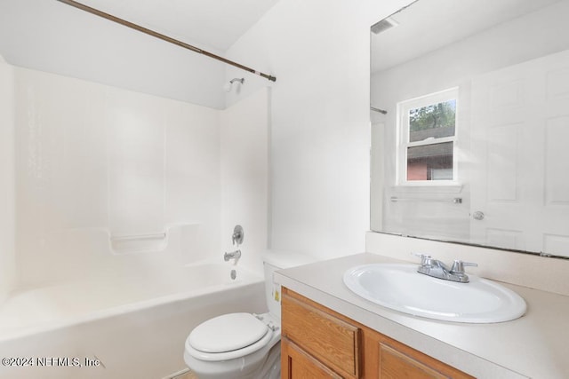 full bathroom featuring shower / tub combination, vanity, and toilet