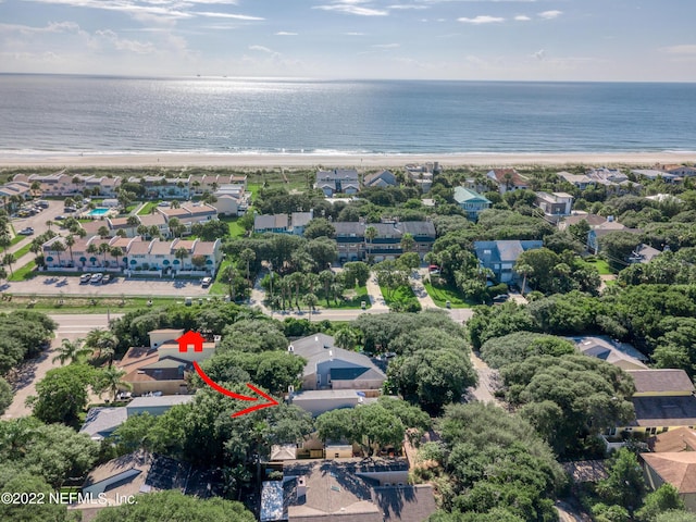 bird's eye view with a water view, a residential view, and a beach view