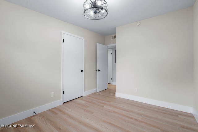 unfurnished room featuring light wood-type flooring