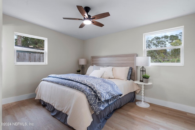 bedroom featuring light hardwood / wood-style floors and ceiling fan