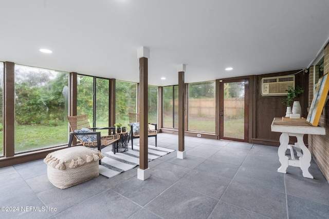 sunroom with an AC wall unit