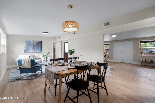 dining area with light wood-type flooring