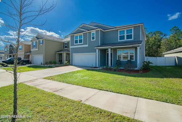 view of front of property featuring a garage and a front lawn