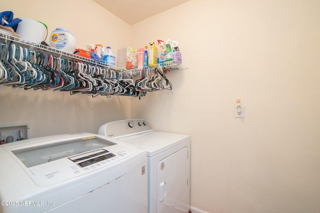 washroom with washing machine and clothes dryer