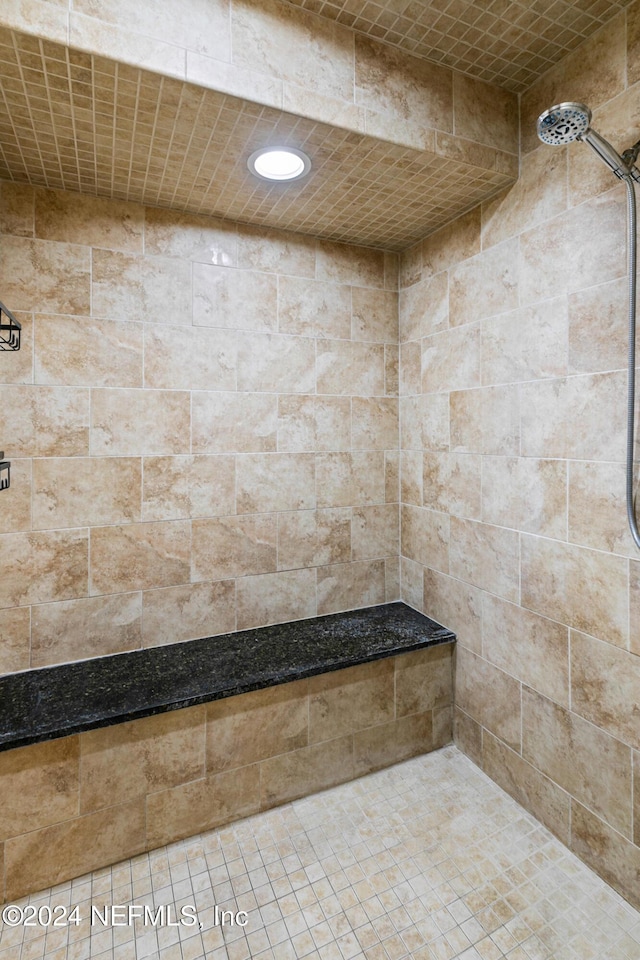 bathroom featuring tiled shower