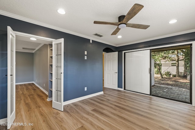 unfurnished bedroom featuring ceiling fan, crown molding, light hardwood / wood-style floors, a textured ceiling, and access to outside