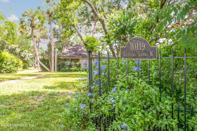 view of property's community with a yard