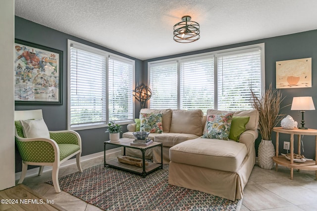 tiled living room with a textured ceiling