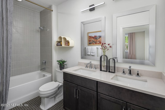 full bathroom with vanity, toilet, tiled shower / bath, and tile patterned floors